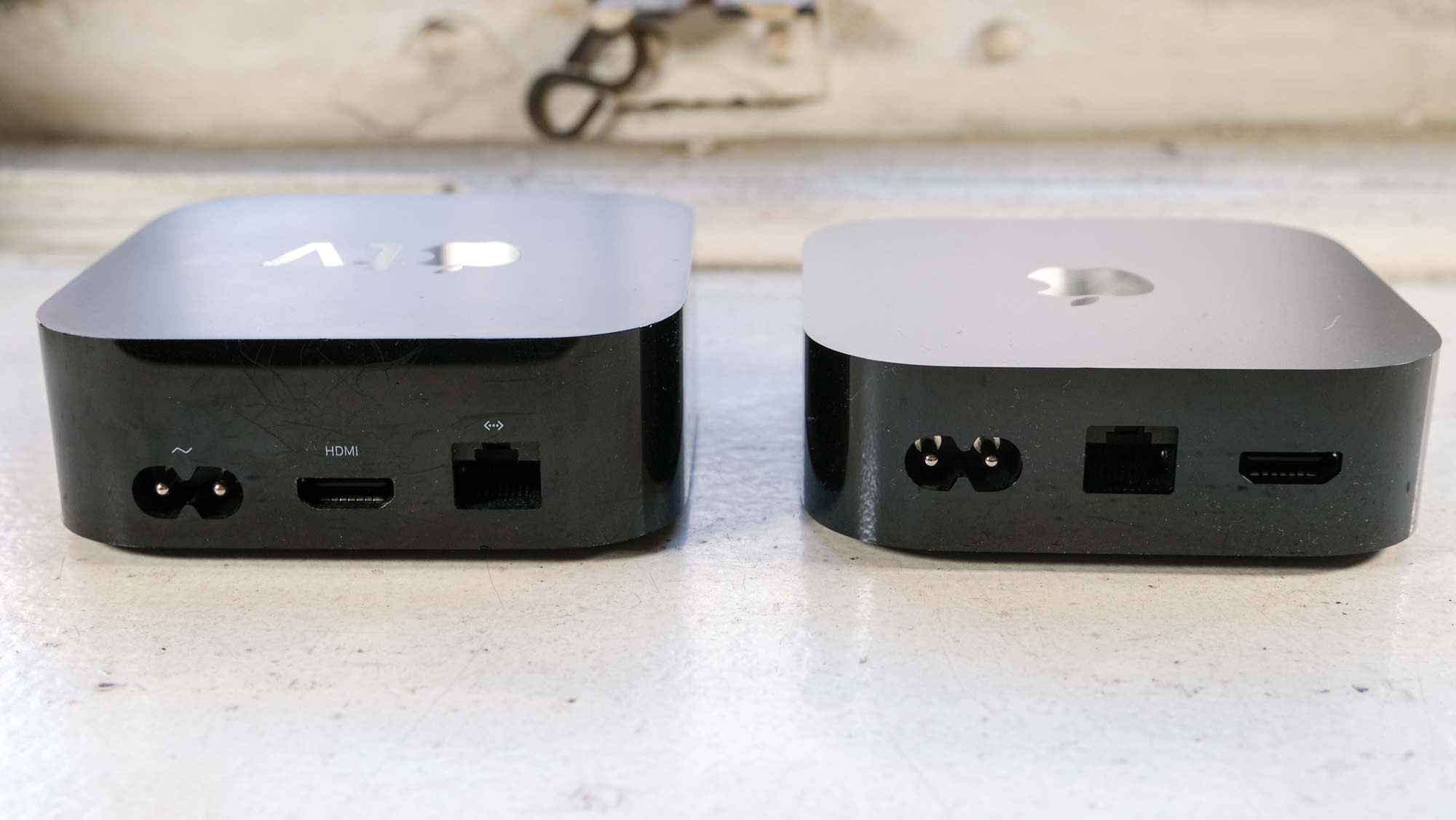 (L, R) The 2021 Apple TV 4K and Apple TV 4K (2022) from behind