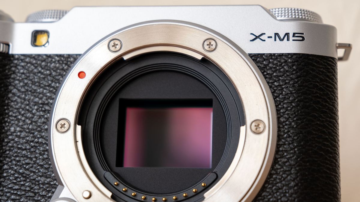 A close-up of the Fujifilm X-M5 with a maroon sensor