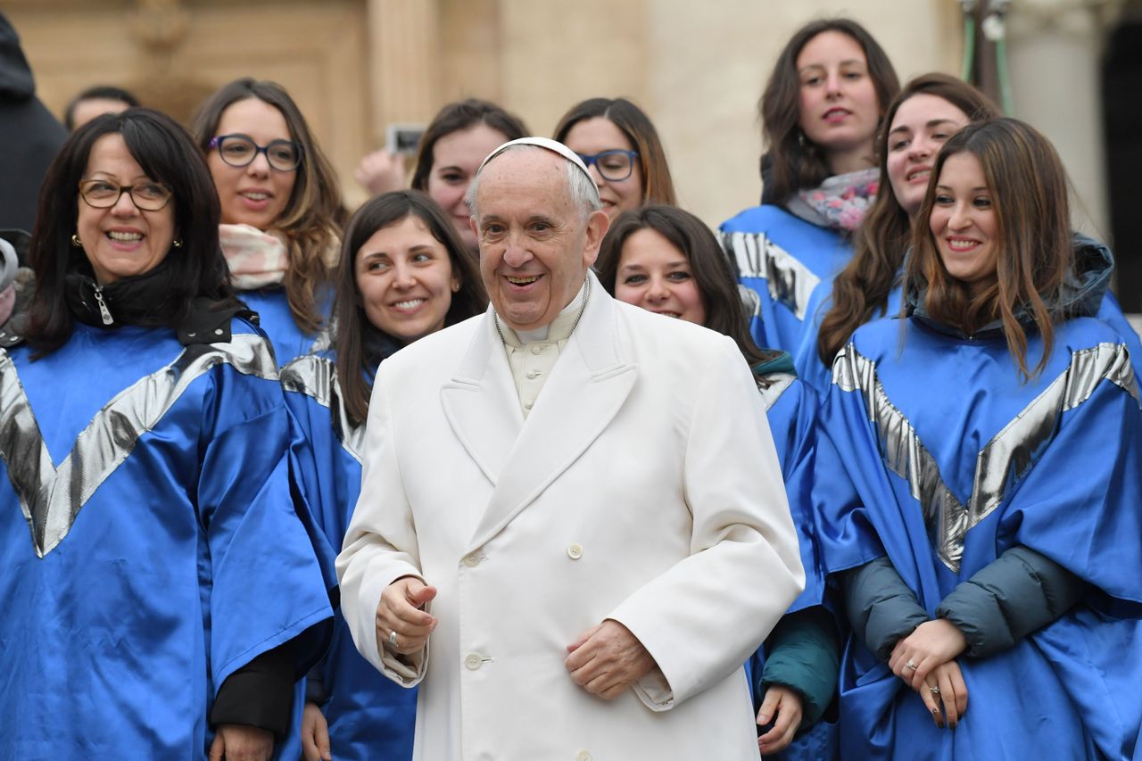 Pope Francis and a choir.