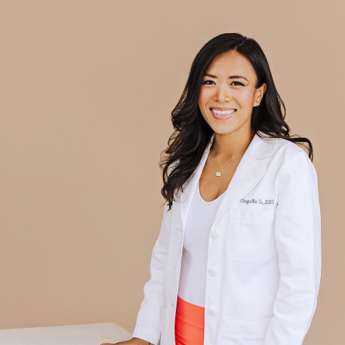 Dr. Chrystle Cu in a white coat