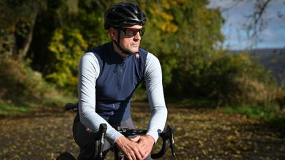 Rider wearing Castelli Espresso Vest sitting on top tube