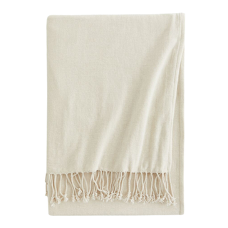 A light beige chenille throw