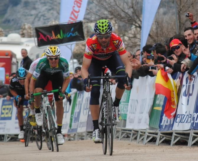 Alejandro Valverde sits before raising his arms.