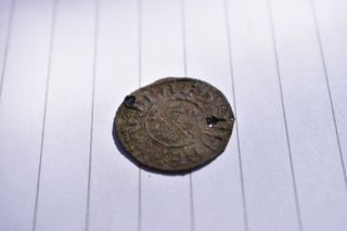 A coin dated to the era of Alfred the Great was found in the remains of a Pictish fort in Scotland.