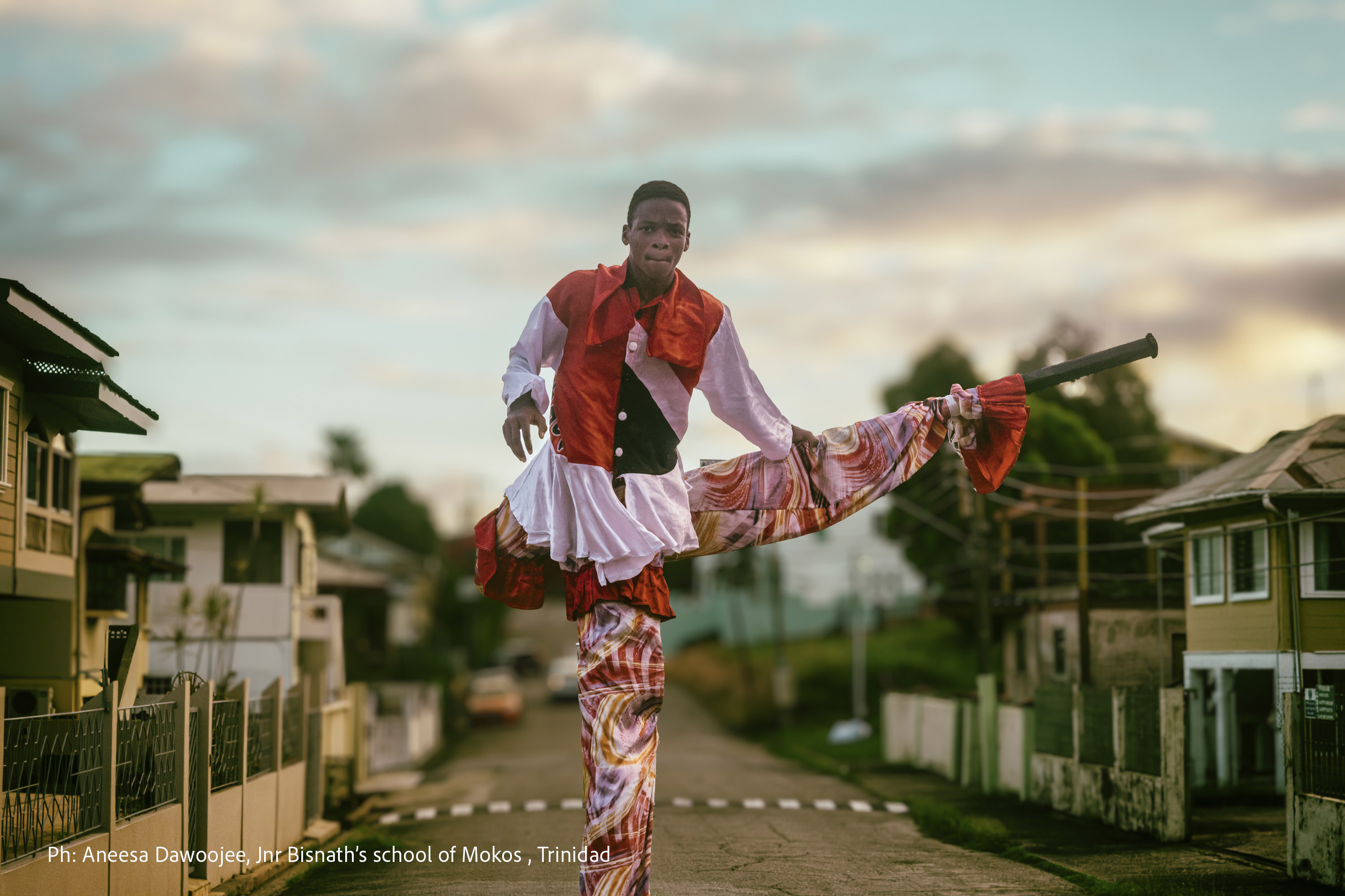Photograph of a young man in a costume in Trinidad in the Caribbean, and titled 'Jnr Bisnath's school of Mokos, Trinidad', taken by photographer Aneesa Dawoojee, a speaker at The Photography &amp;amp; Video Show 2026