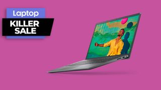 Dell Inspiron 15 laptop against a pink background