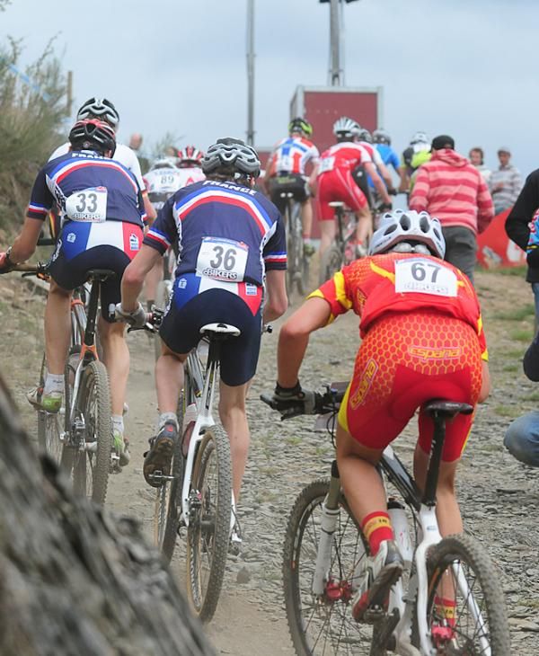 Riders on a steep loose climb.