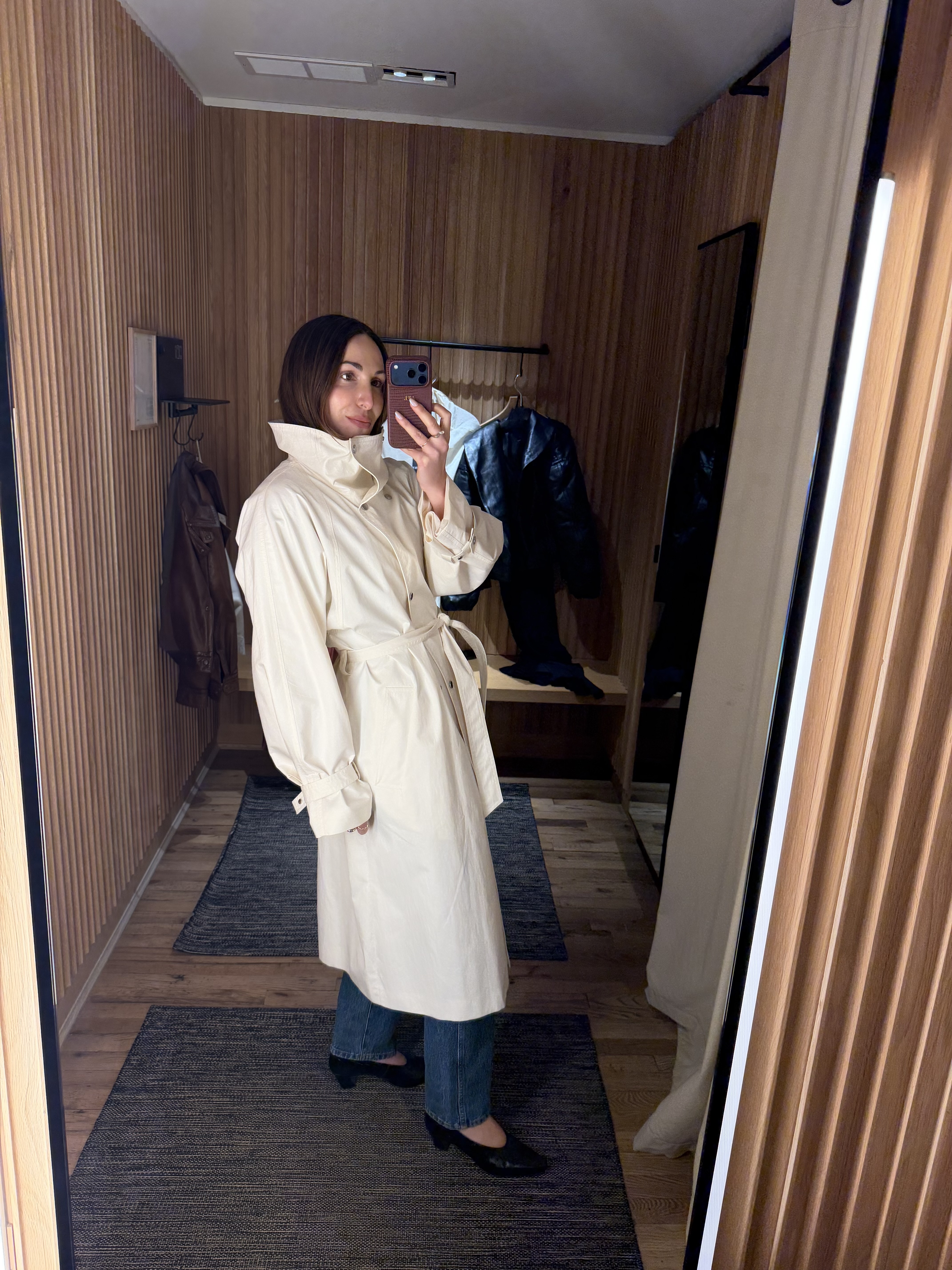 senior fashion editor Anna LaPlaca wearing Mango Selection pieces inside a store dressing room