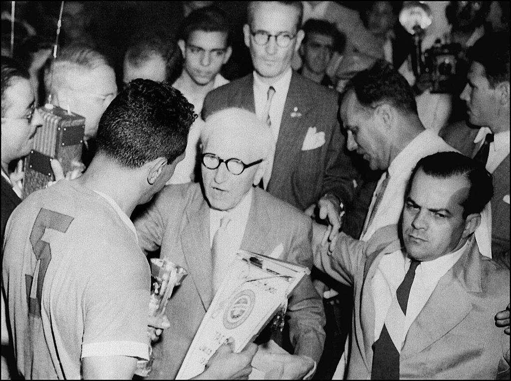 Jules Rimet presents the trophy to Uruguay again in 1950