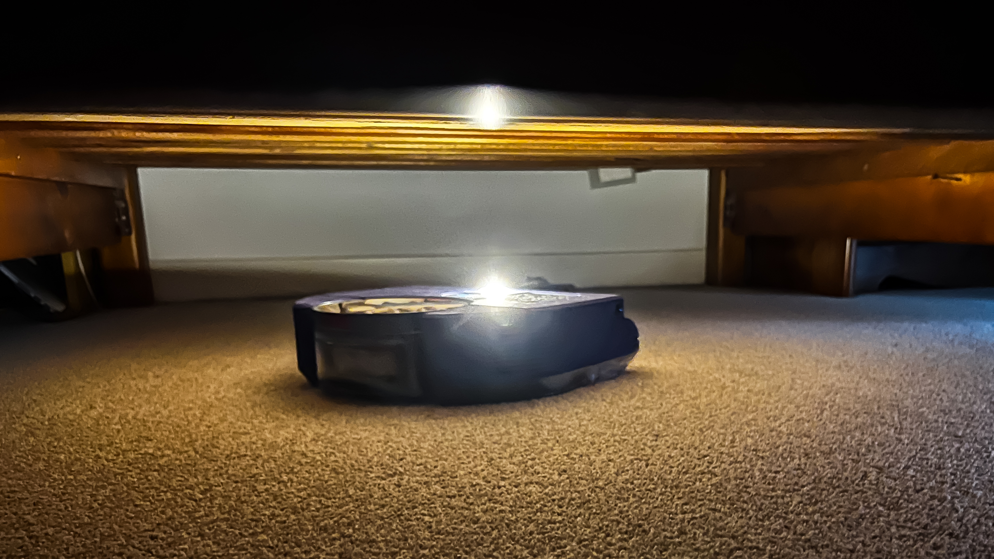 A light comes on when the Dyson 360 Vis Nav is in dark rooms and spaces