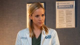 Hannah looking at a patient in Chicago Med Season 11x08