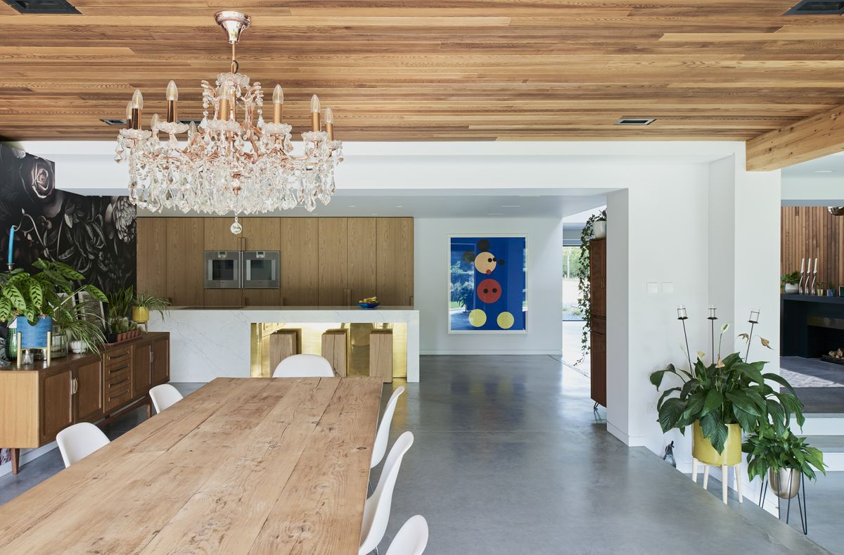 open plan kitchen with gallery wall and dining area