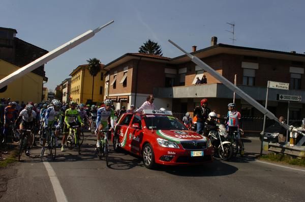 The peloton was delayed by a train.