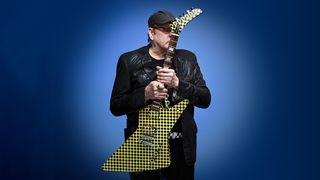 Rick Nielsen holding his Checkerboard Hamer Standard