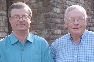 Neil Armstrong (right) poses with his authorized biographer James Hansen, author of "First Man," in 2004.