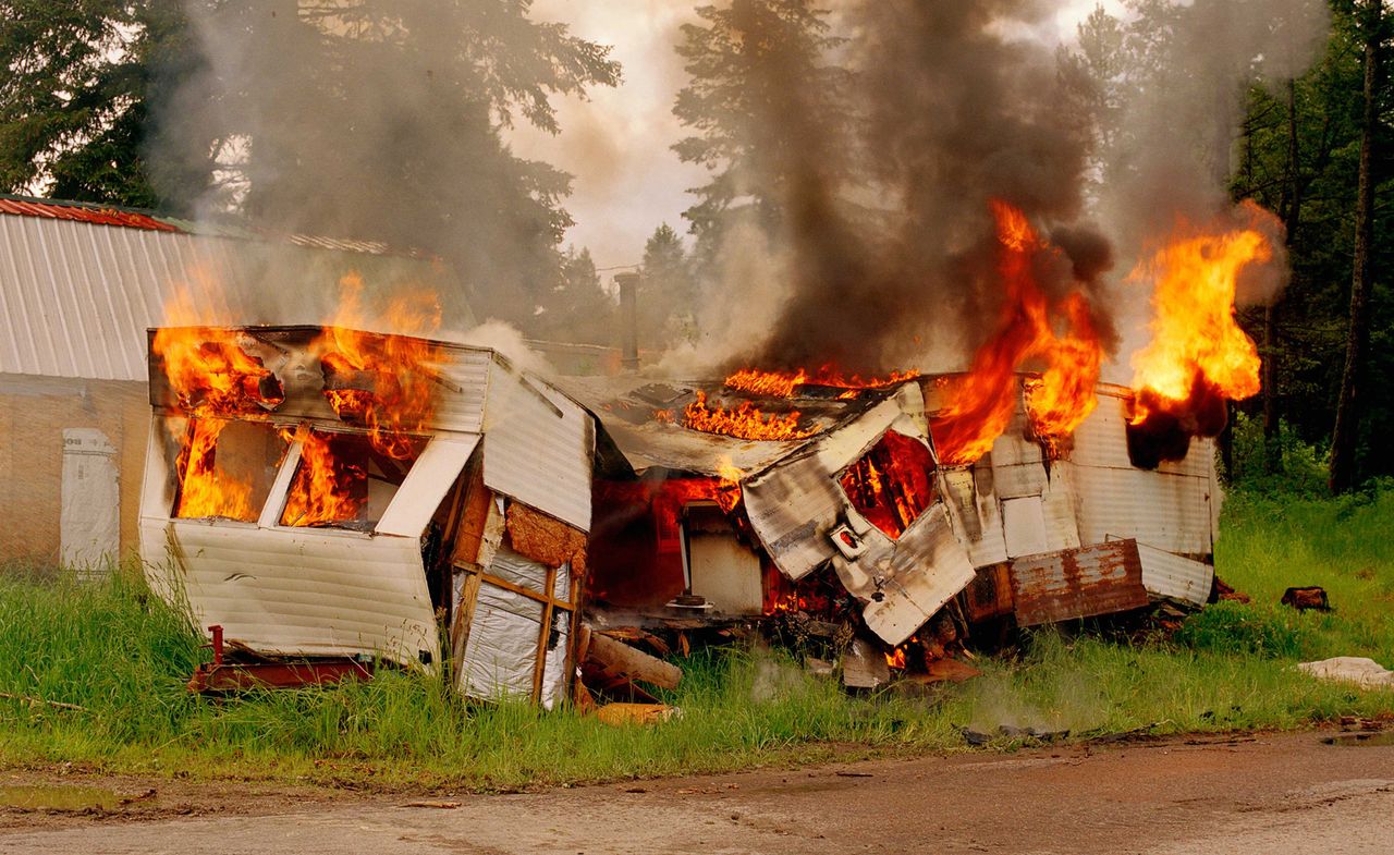 Photograph of a burning caravan