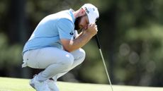 Tyrrell Hatton of England reacts on the 18th green during the second round of the 2024 Masters