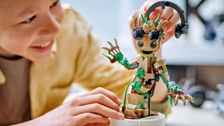 Kid building Lego Dancing Groot set