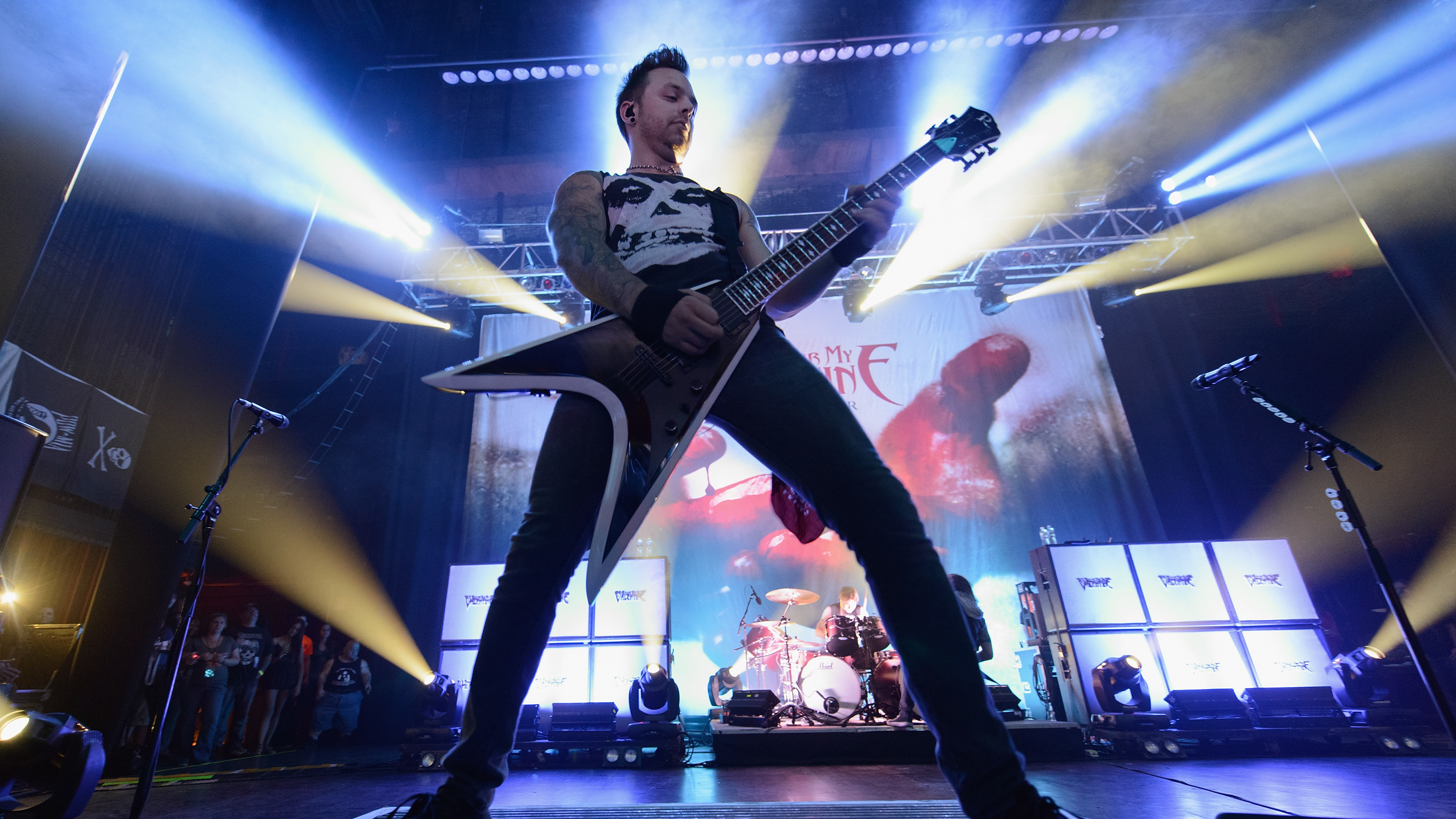 a photograph of Mack Tuck of Bullet For My Valentine on stage in 2013