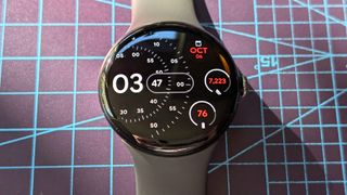 Close-up of the Google Pixel Watch 4 in black on a black strap