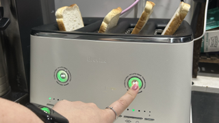 Finger activating Normal mode on Breville Eye Q toaster