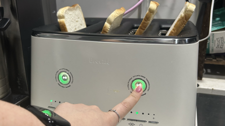 Finger activating Normal mode on Breville Eye Q toaster