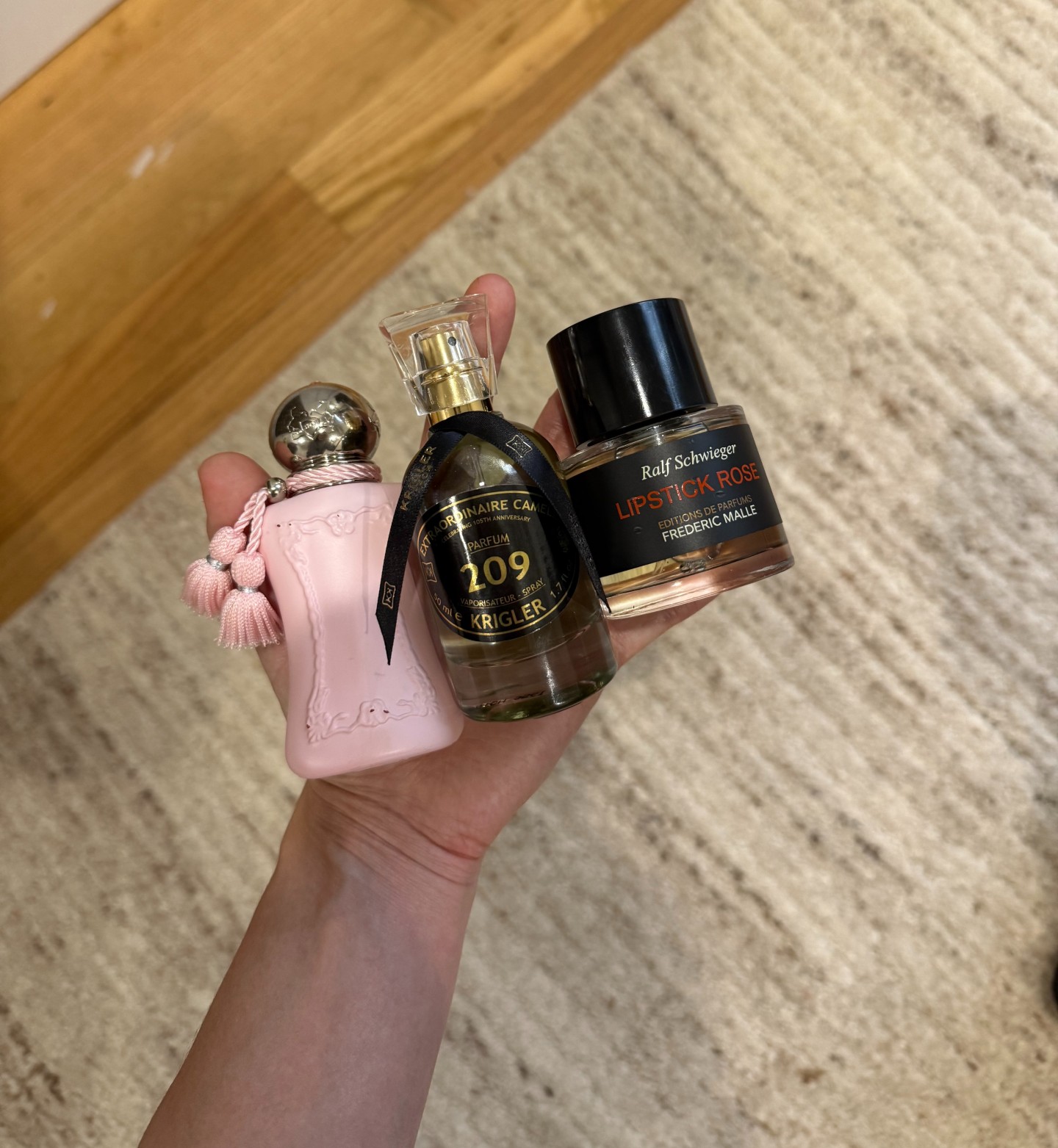 Photo of Jamie Schneider testing expensive-smelling floral perfumes