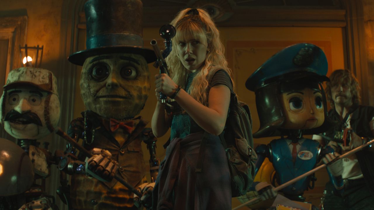 millie bobby brown and a team of robots wield weapons in a still from the movie the action state