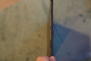 The Lenovo Tab P11 Plus shown vertically to see its narrow thickness