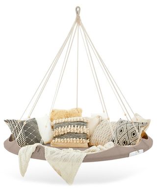 A suspended porch swing with taupe-colored base