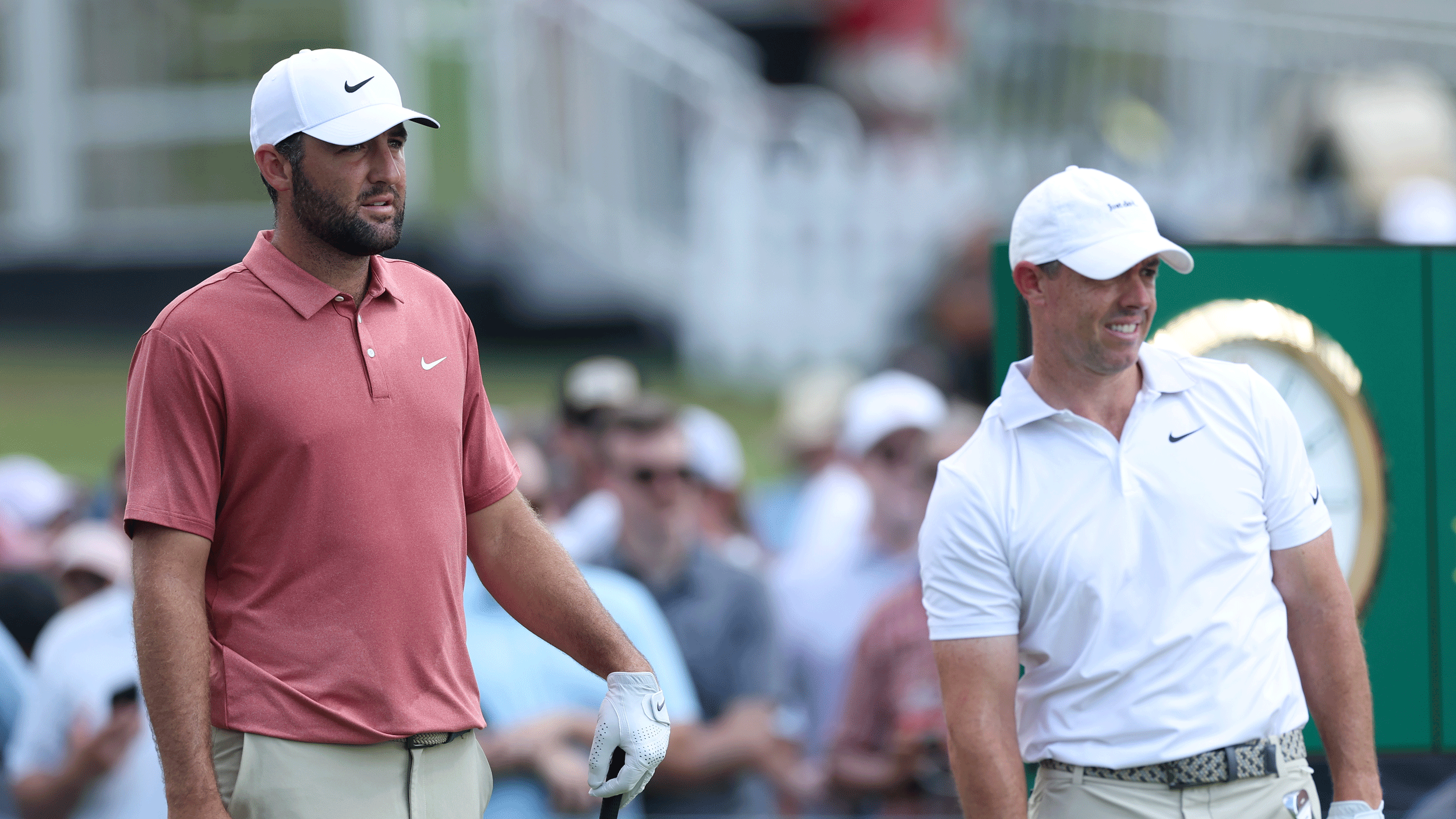 Scottie Scheffler (left) and Rory McIlroy look on during the 2025 Tour Championship