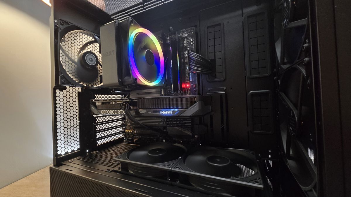 A Lian Li Lancool 217 on a desk with various components installed inside it.
