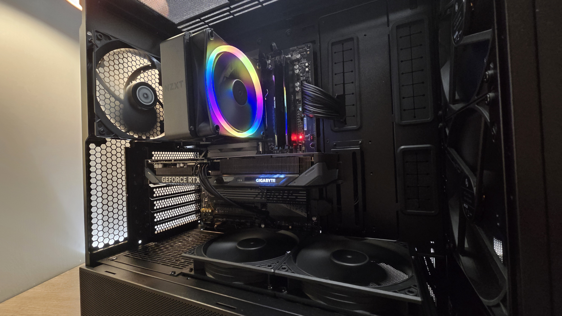 A Lian Li Lancool 217 on a desk with various components installed inside it.