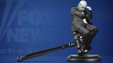 Rupert Murdoch sitting on a gavel