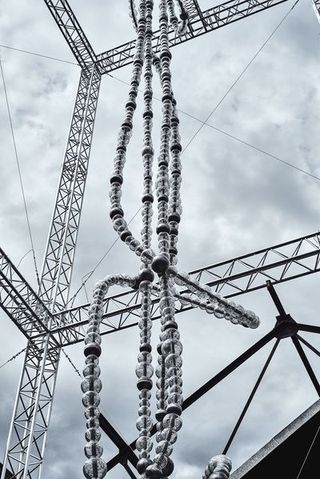 Transmission tower, Tower, Electricity, Electrical supply, Overhead power line, Line, Public utility, Architecture, Parallel, Metal,