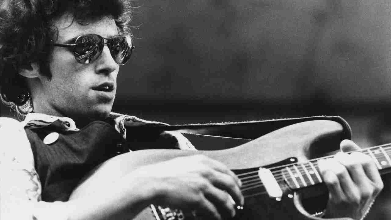 Nils Lofgren performing onstage in the 1970s
