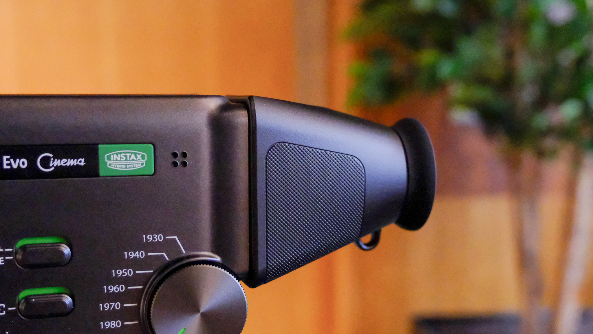 A black Fujifilm Instax mini Evo Cinema hybrid instant camera