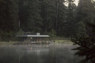misty lake shot with Pabellón De La Reserva in Mexico