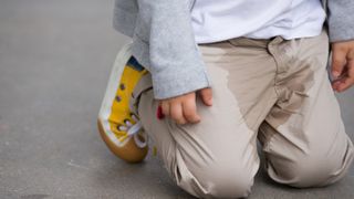 Child pees himself in the street