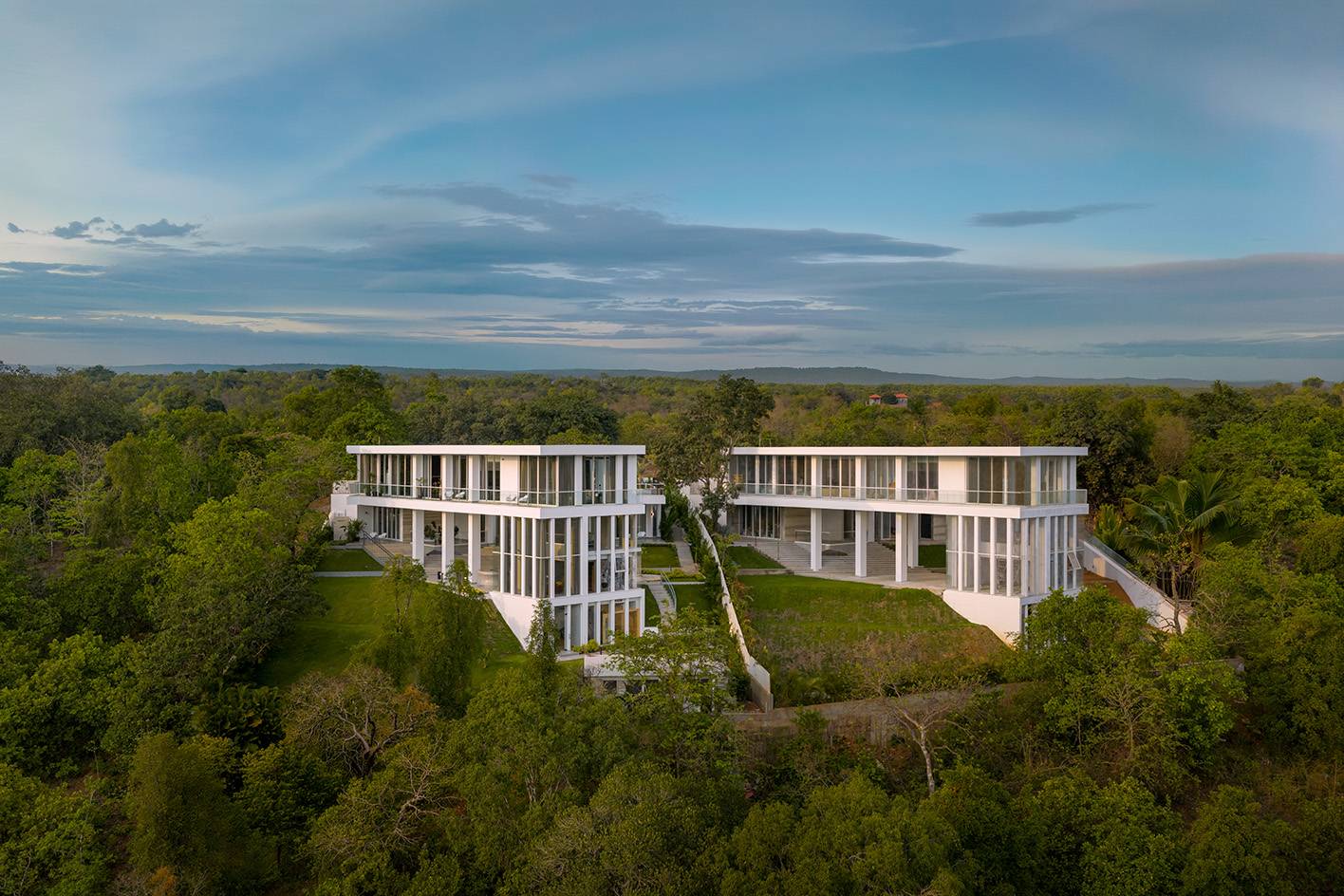 a white Goa villa in the leafy indian forest