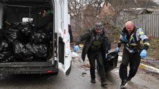 Bodies being loaded in to a van in Bucha, Ukraine