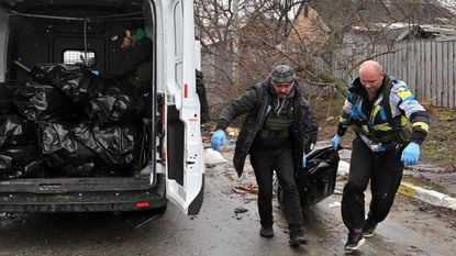 Bodies being loaded in to a van in Bucha, Ukraine