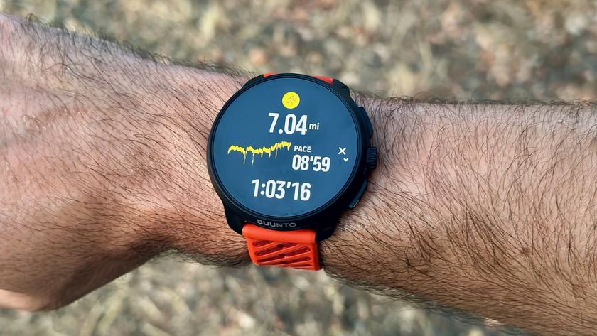 The Suunto Race 2 on the author&#039;s wrist showing a post-run summary with mileage, pace, and duration.
