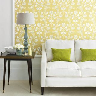 living room with yellow wallpaper and couch