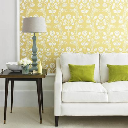 living room with yellow wallpaper and couch