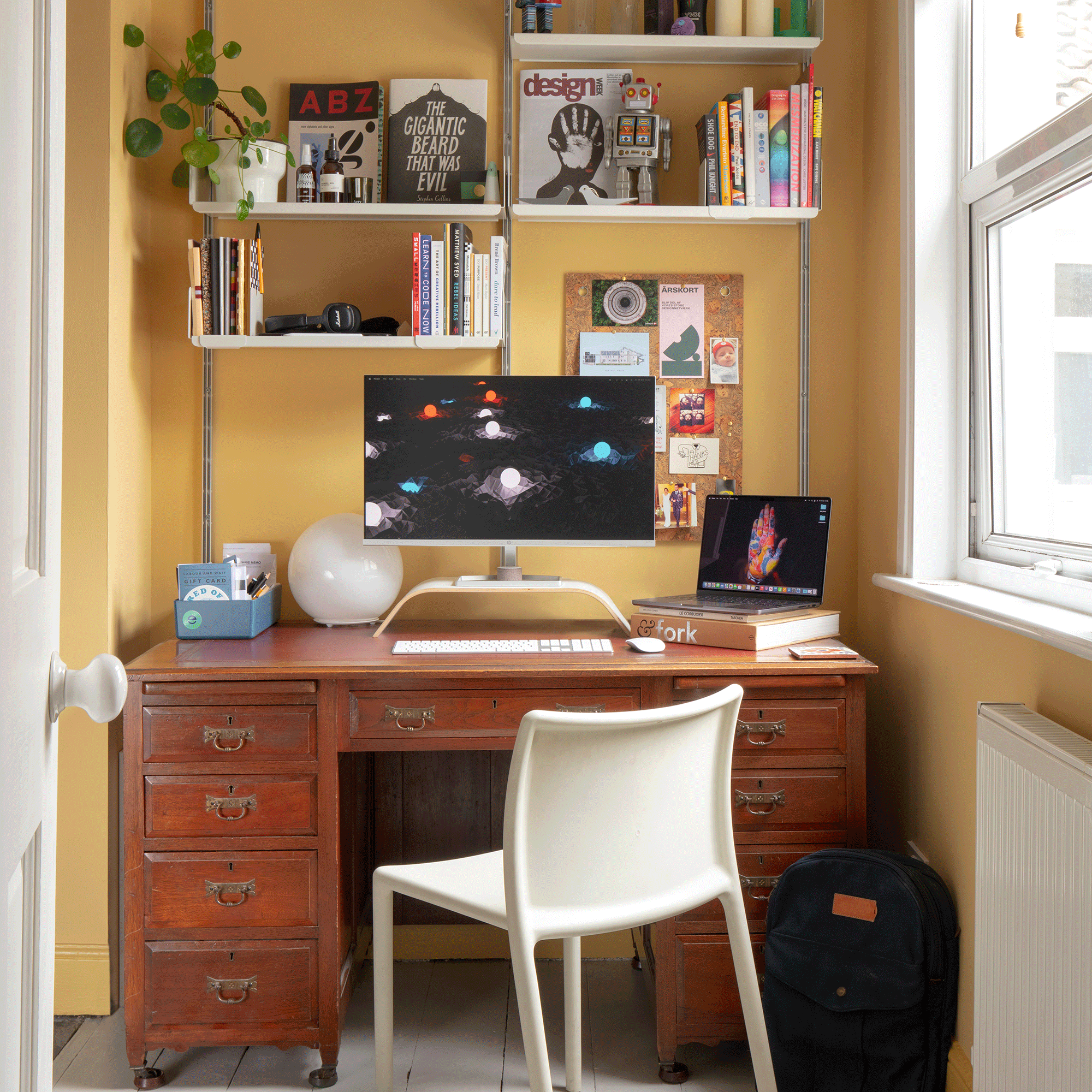 Yellow home office with wooden desk