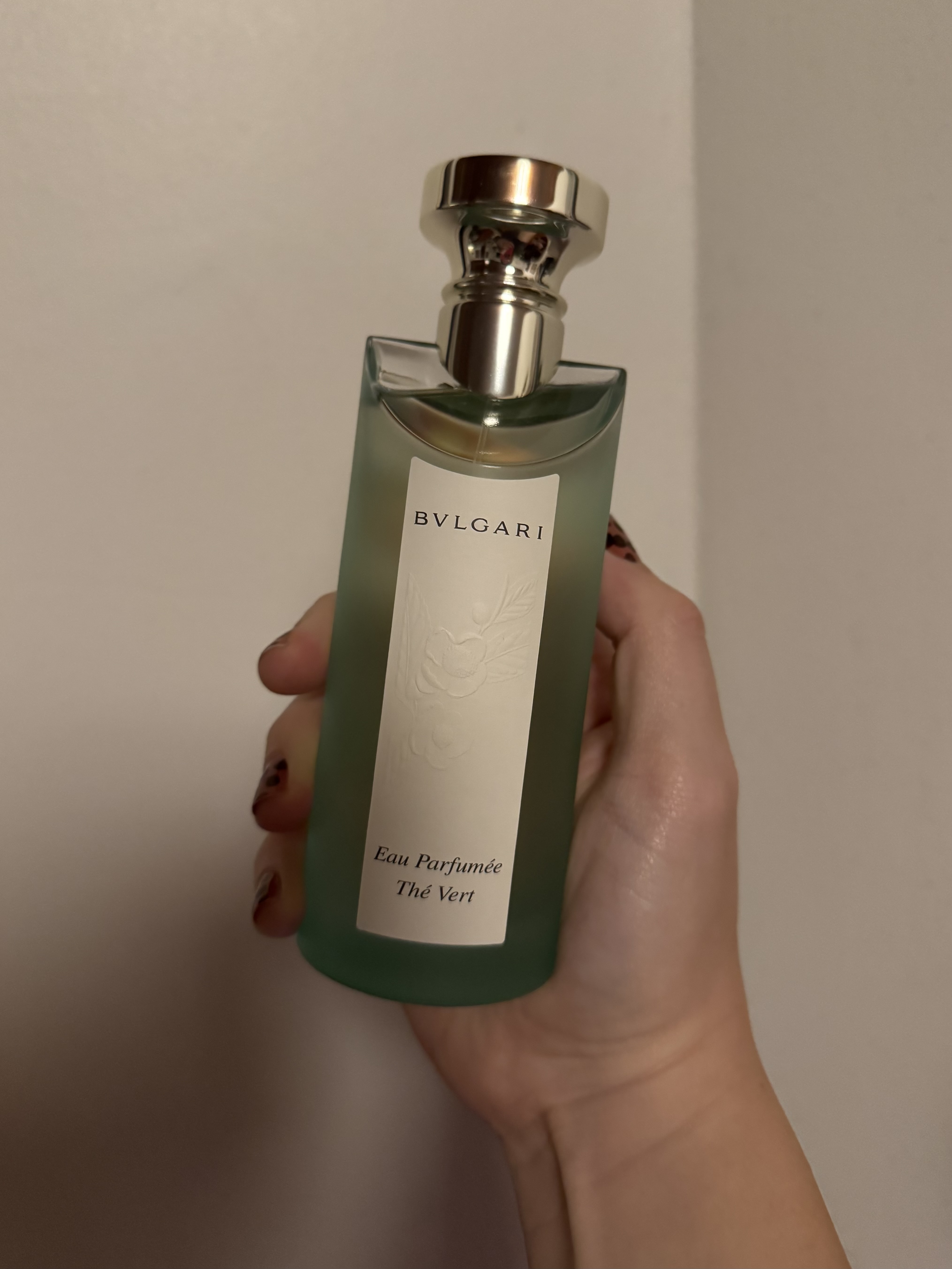 Sophia Vilensky holds a bottle of Bulgari Eau Parfumee The Vert.