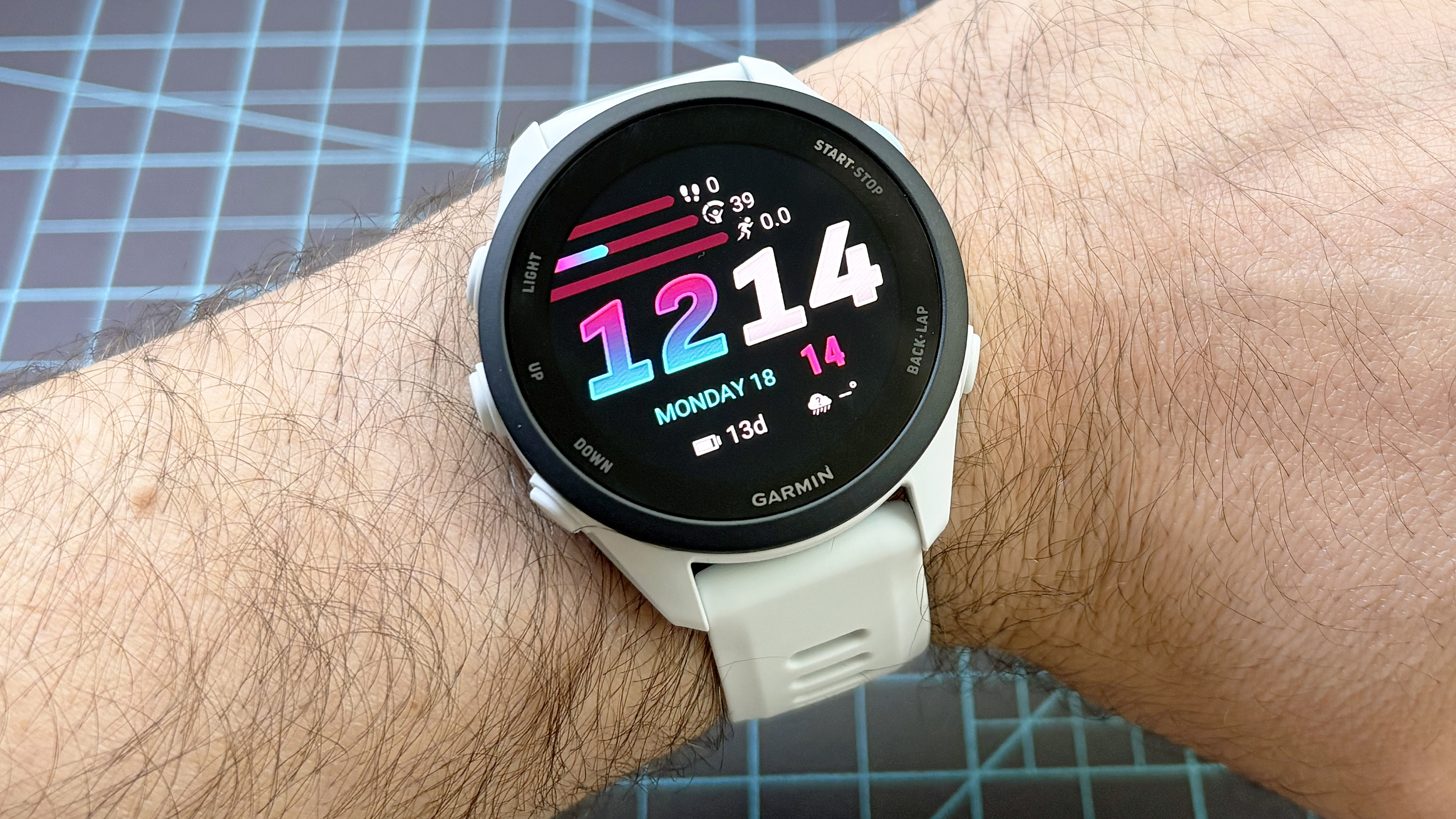 Close-up of the Garmin Forerunner 70 entry-level running watch in white