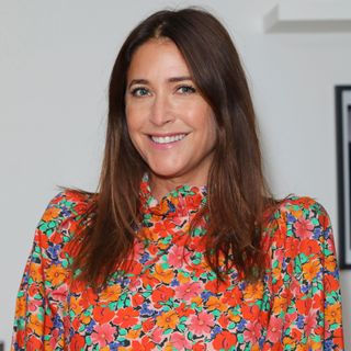 Lisa Snowdon in a red floral dress