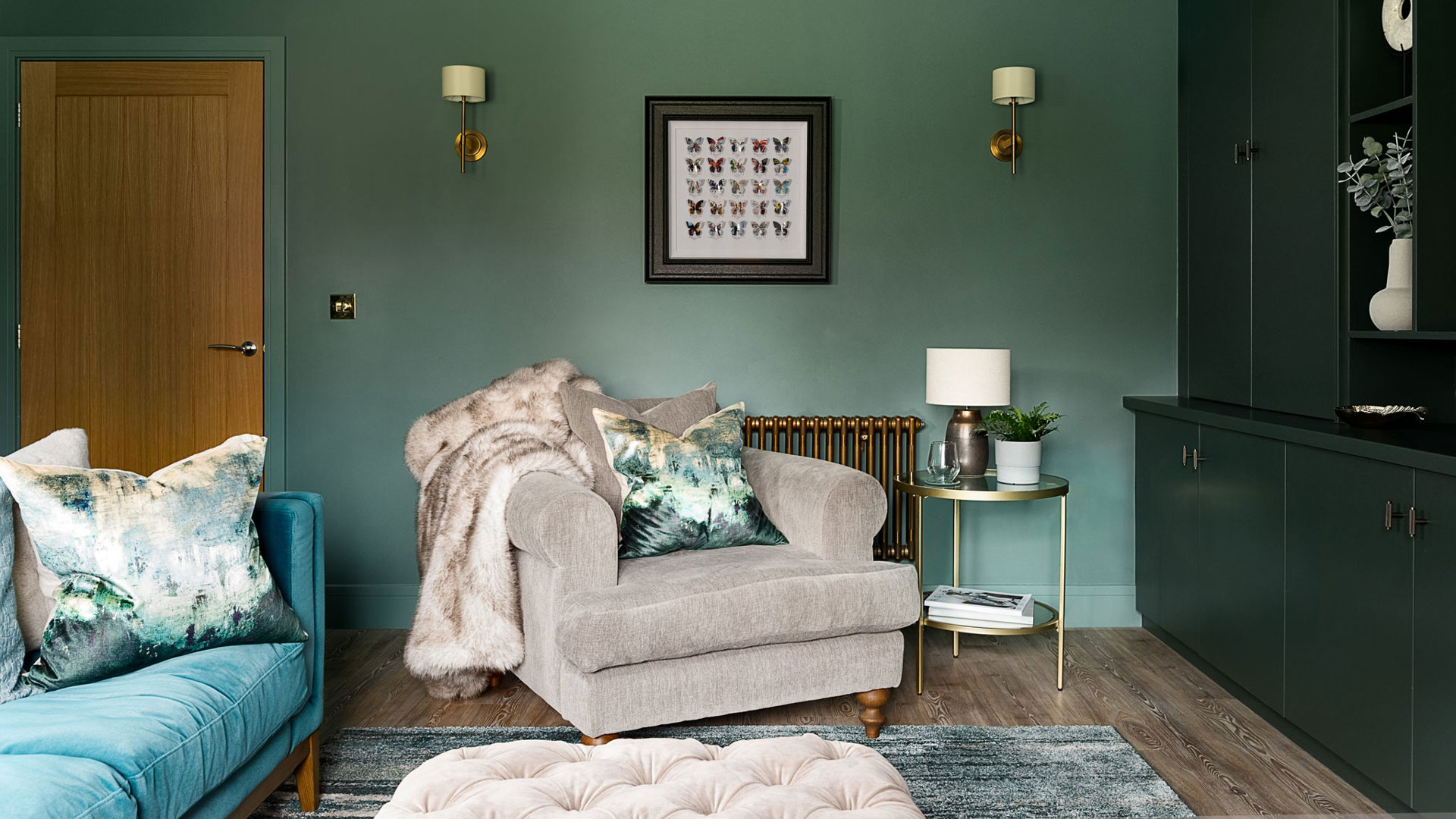 green living room with teal velvet sofa